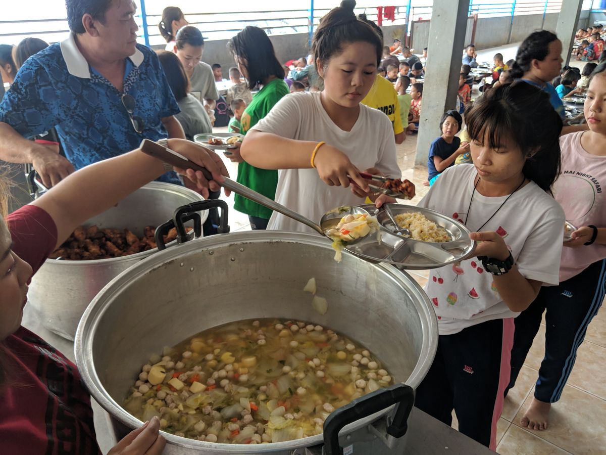 Serving lunch at Wat Don Chan Orphanage, Chiang Mai, Thailand, 2019
