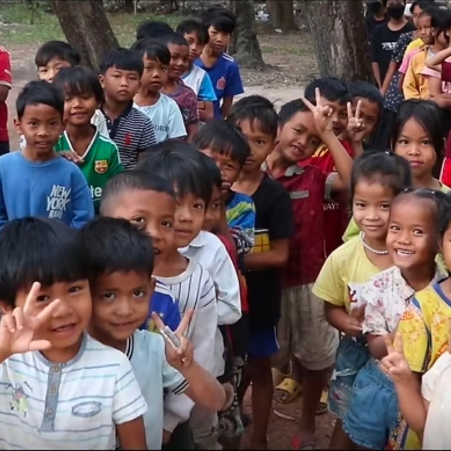 Smiling ODA students crowding toward the camera