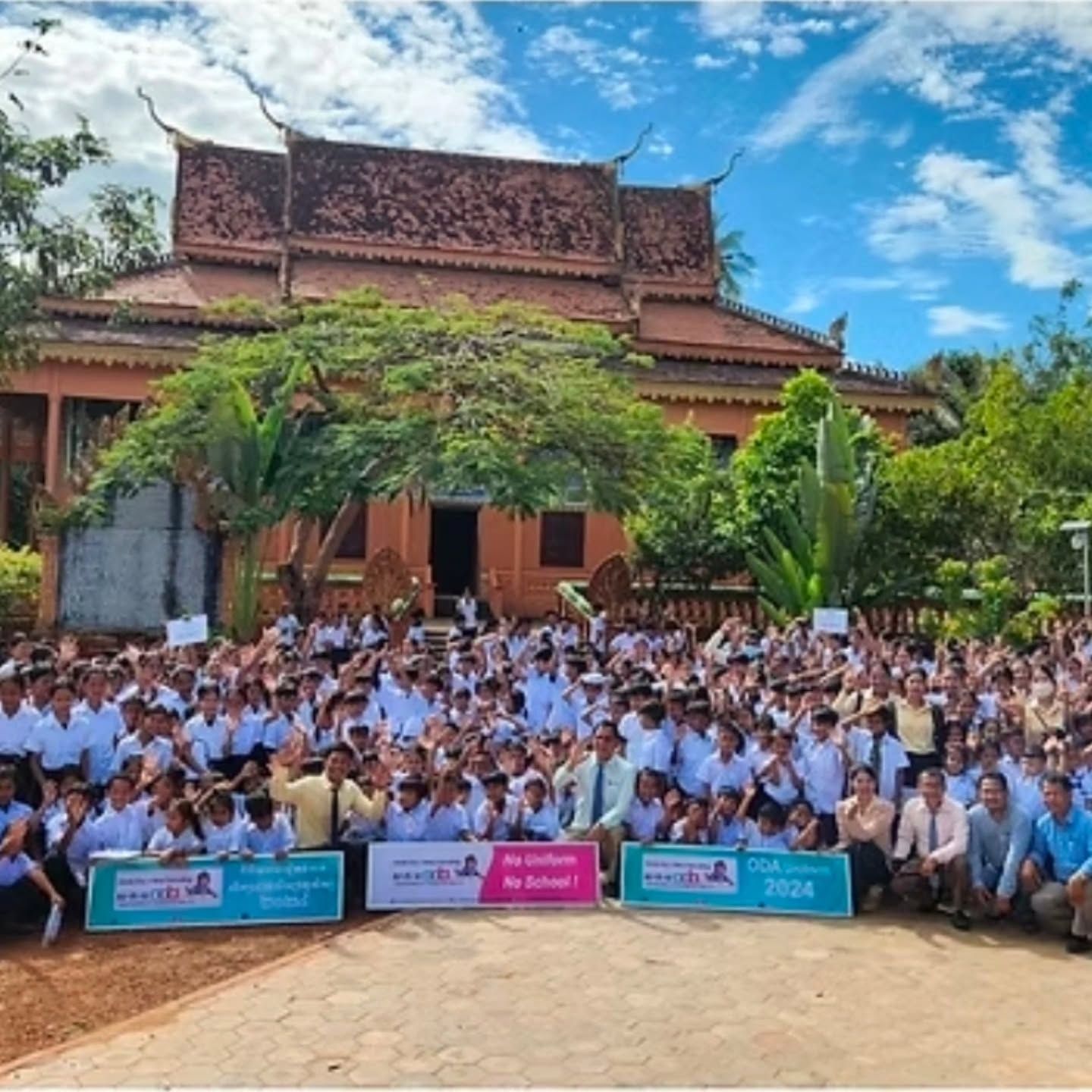 Hundreds of ODA students gathered in front of a school building in Cambodia