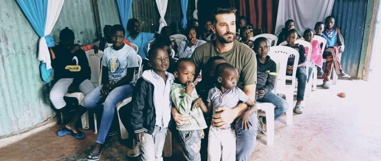 Children gathered in a small hall in Nairobi